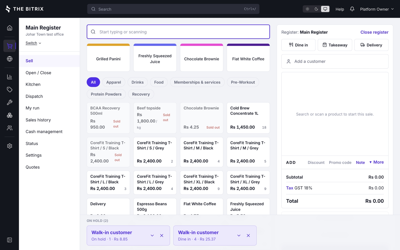 The till, with a product grid, category filters, the order type buttons, a cart showing GST, and two held orders along the bottom.